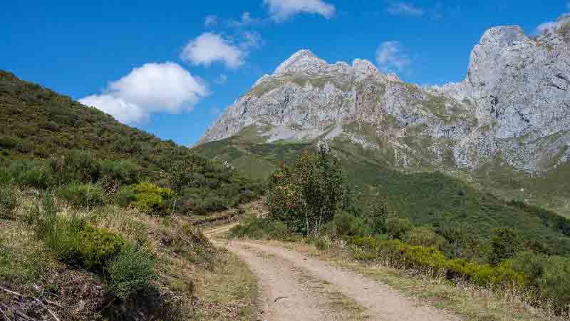 Hiking path in the Picos de Europa under a clear blue sky Hiking trail with mountain views in the Picos de Europa, northern Spain