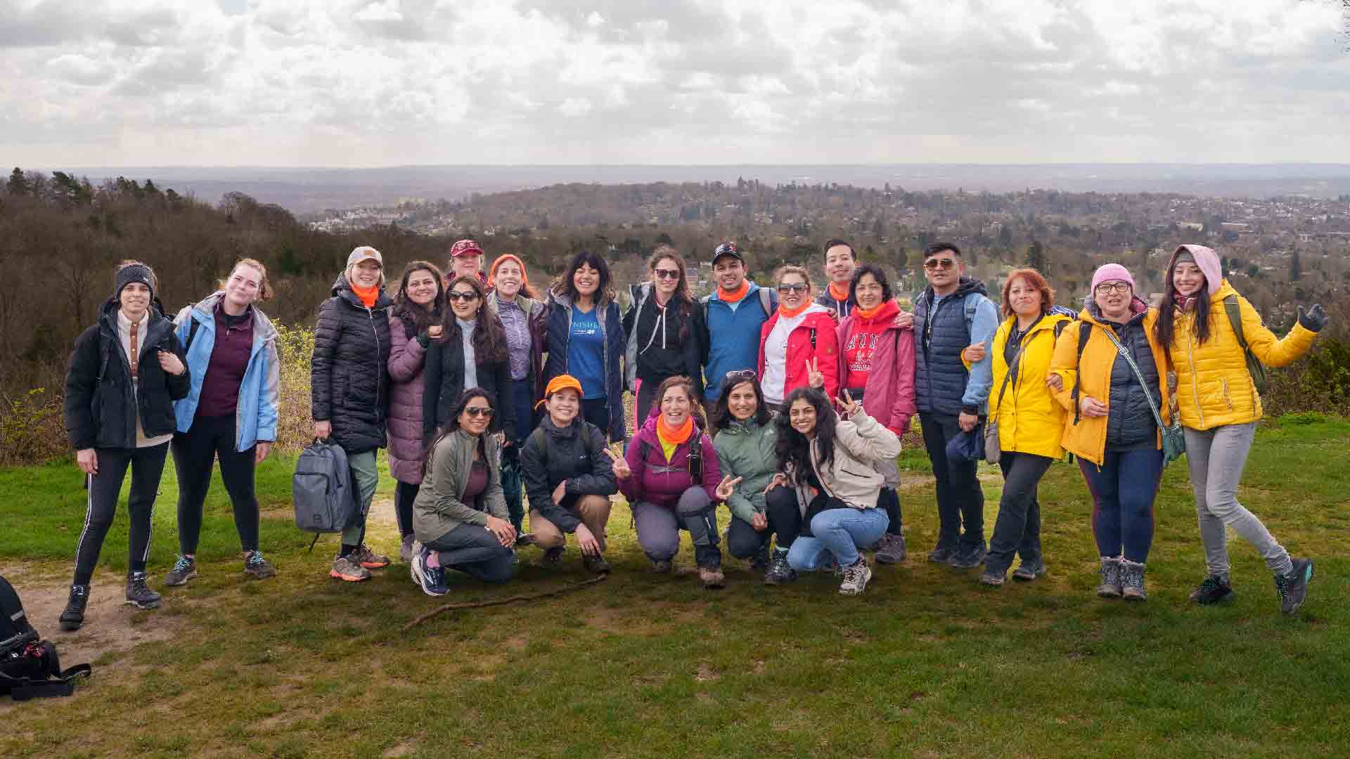 Hiking group at a beautiful viewpoint Hiking in London group enjoying a scenic viewpoint