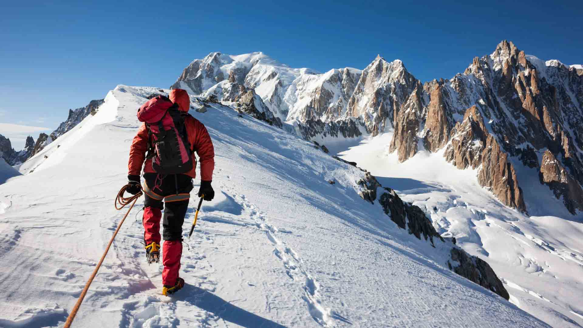 Mont Blanc Summit – Hiking in London Club 2025 Spartan Expedition. Climber roped in on snowy ridge approaching Mont Blanc summit with surrounding alpine peaks, part of Hiking in London Club 2025 Spartan expedition.